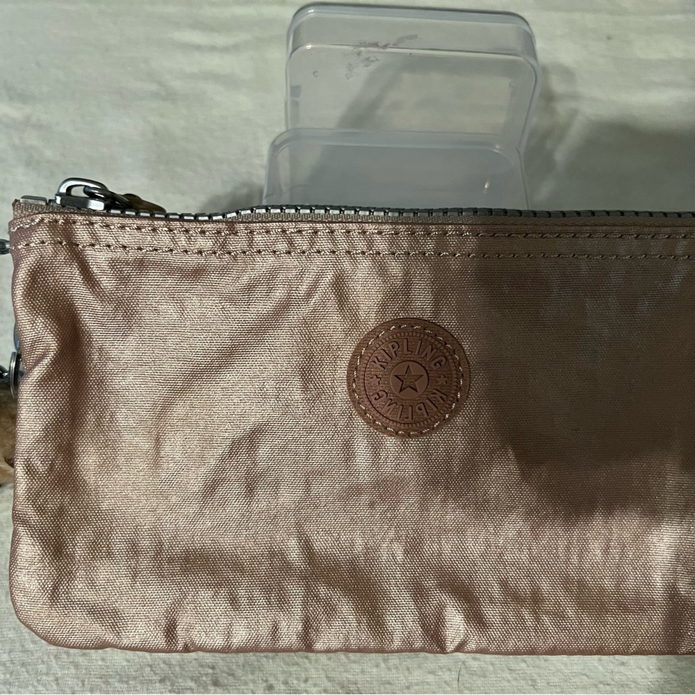 Anything wallet three open pockets durable material, very cute.
